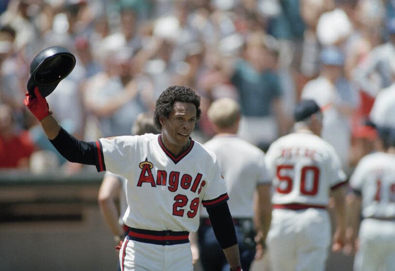 Rod Carew acknowledges the fans after his 3,000th career hit.