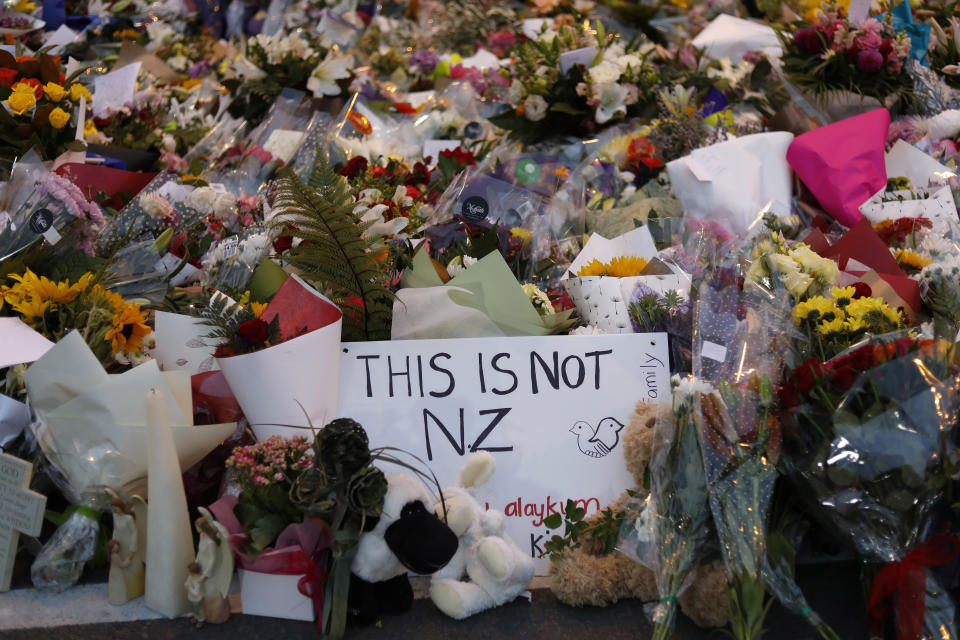 FILE - In this March 16, 2019, file photo, flowers lay at a memorial near the Masjid Al Noor mosque for victims in March 15 shooting in Christchurch, New Zealand. New Zealanders are debating the limits of free speech after their chief censor banned a 74-page manifesto written by a man accused of massacring 50 people at two mosques. (AP Photo/Vincent Yu, File)