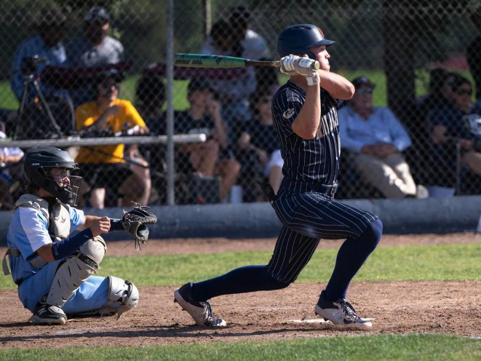 Central Catholic’s TP Wentworth drives a ball for a homer during the Northern California Regional Division III championship game with Oakmont at Central Catholic High School in Modesto, Calif., Saturday, June 3, 2023. Central Catholic won 5-2.