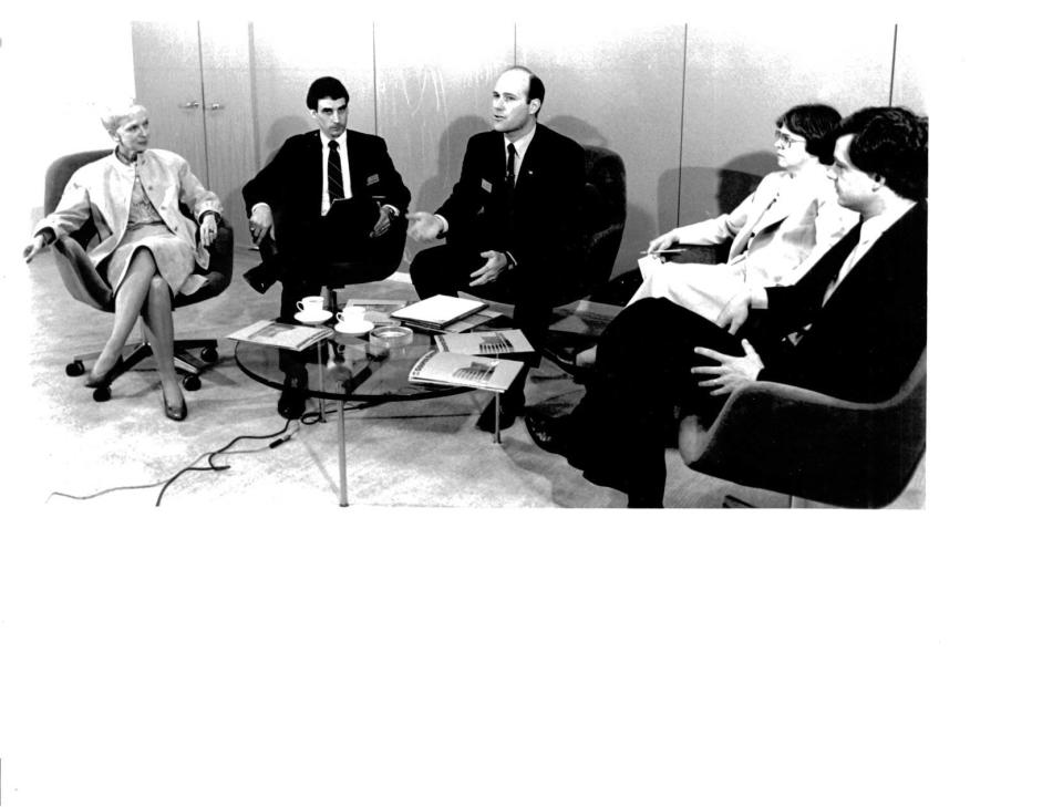 Ernestine M. Raclin, left, attends an open house at 1st Source Bank in South Bend in this May 13, 1982, file photo. Raclin's son-in-law, Chris Murphy, the bank's current CEO, is in the middle. A philanthropist and former chair of 1st Source Bank and 1st Source Corporation, she died July 13, 2023, at the age of 95.