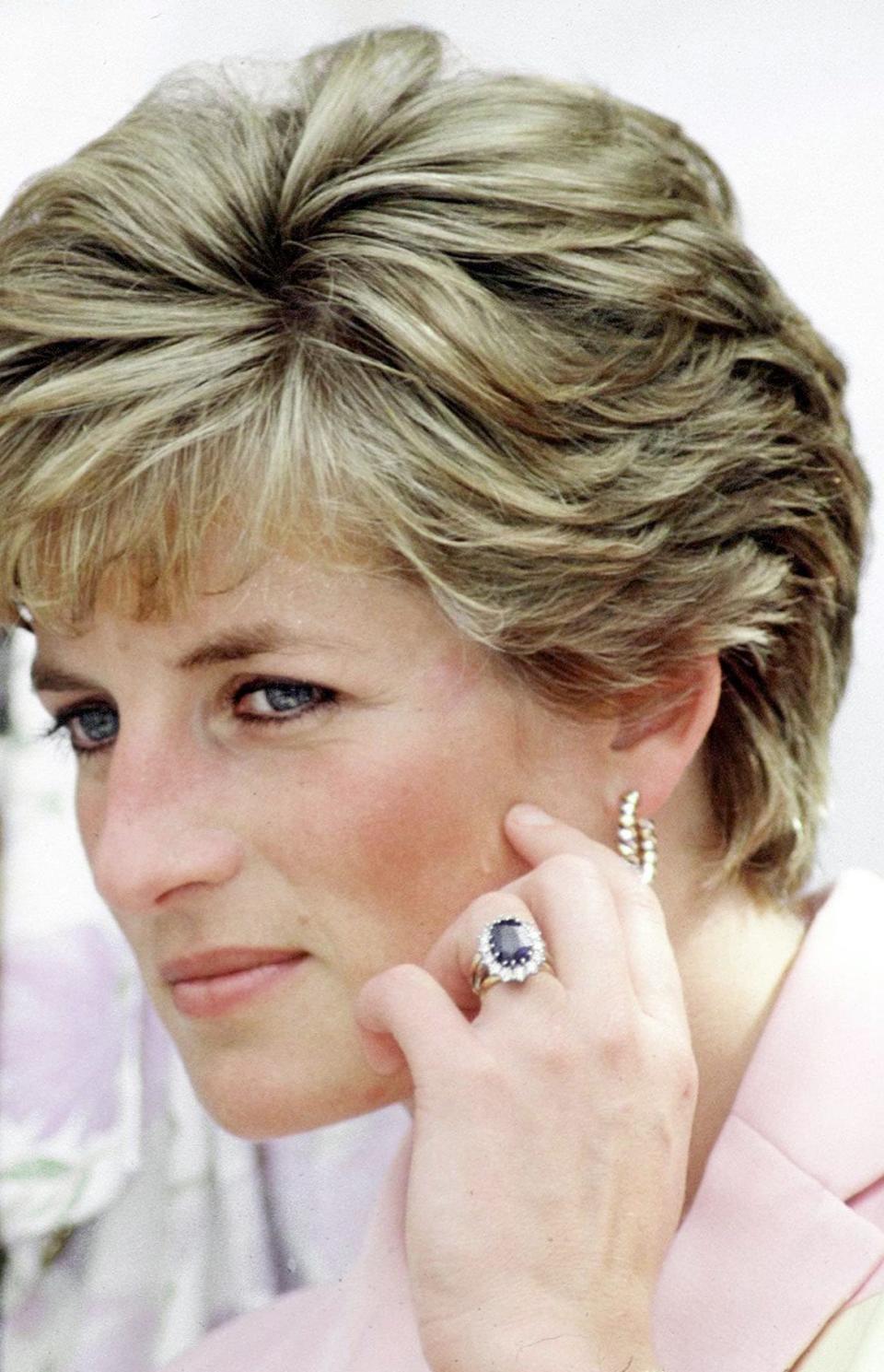 Princess Diana wearing her sapphire and diamond engagement ring - Tim Graham Photo Library via Getty Images