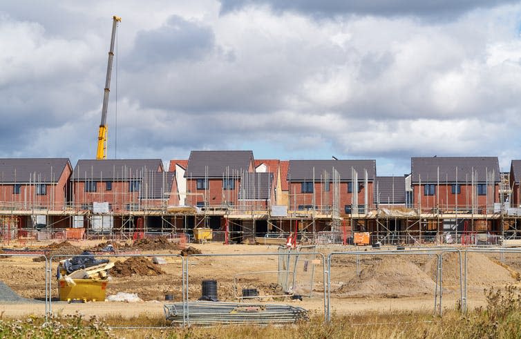 <span class="caption">UK house building tends to bake in car dependency.</span> <span class="attribution"><a class="link " href="https://www.shutterstock.com/image-photo/newly-built-homes-residential-estate-england-403894639" rel="nofollow noopener" target="_blank" data-ylk="slk:Duncan Andison/Shutterstock;elm:context_link;itc:0;sec:content-canvas">Duncan Andison/Shutterstock</a></span>