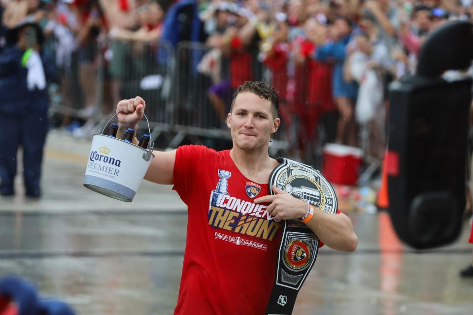 Florida Panthers left wing Matthew Tkachuk celebrates with fans during the Stanley Cup victory parade and celebration.