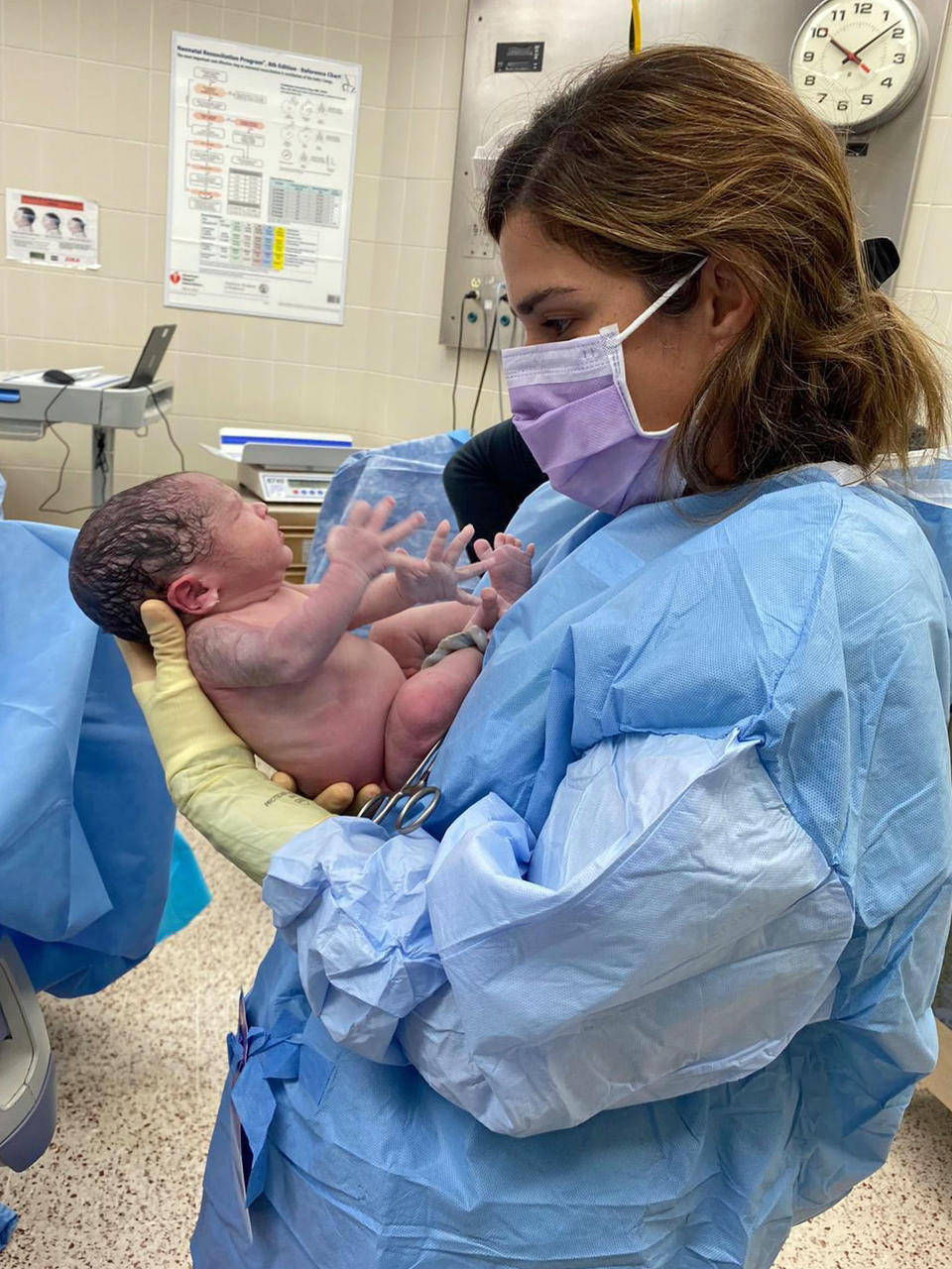 Dr. Zaskia Rodriguez, meeting a patient's newborn for the first time. (Dr. Zaskia Rodriguez)