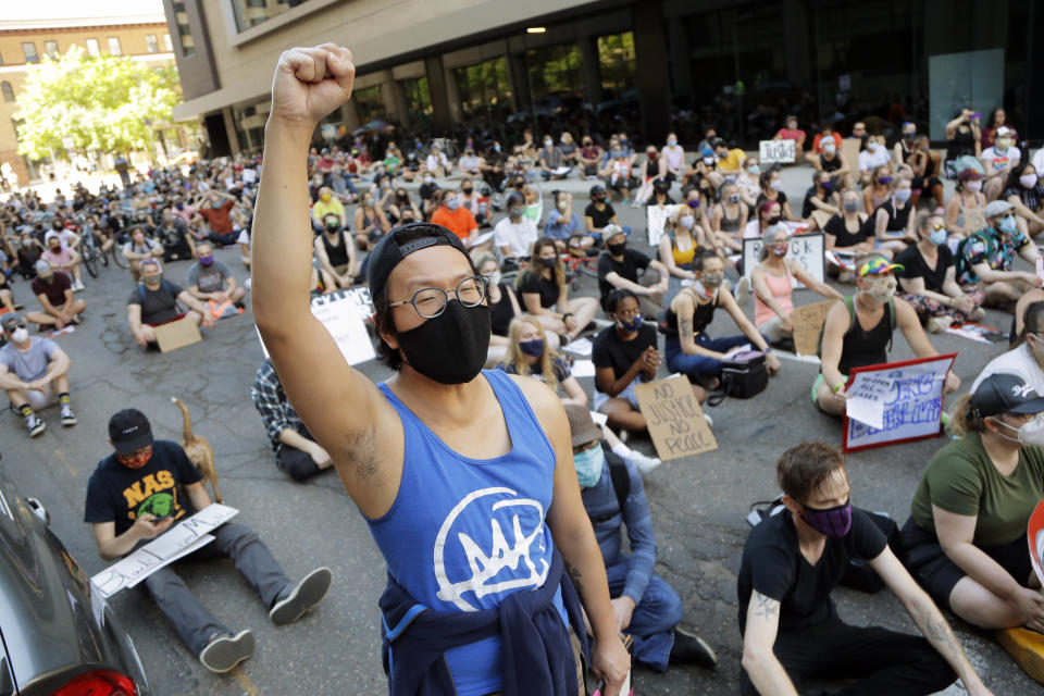 Demonstrators gather in St. Paul, Minn. on Friday, June 5, 2020. Protests continue over the death of George Floyd, a black man who died while in police custody in Minneapolis. (AP Photo/Julio Cortez)