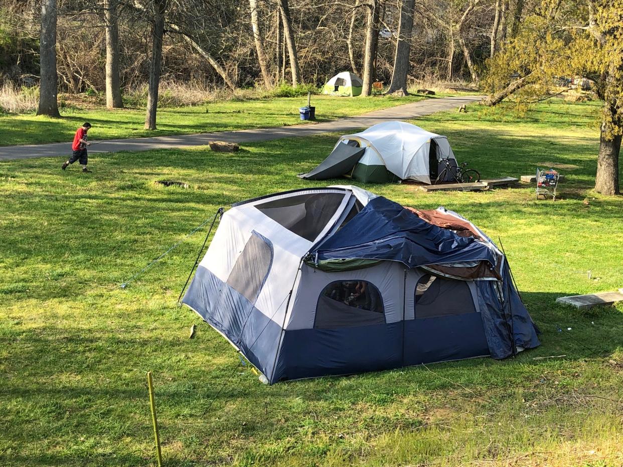 Tents set up Riverbend Park near the Walmart in East Asheville are pictured in this file photo from April 8, 2021.