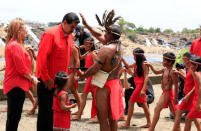 Venezuela's President Nicolas Maduro and his wife Cilia Flores take part in a ceremony with indigenous representatives as they arrive at a campaign rally in Ciudad Guayana, Venezuela April 23, 2018. Miraflores Palace/Handout via REUTERS