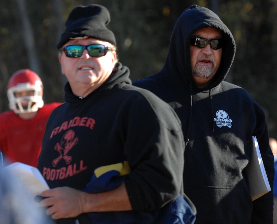 Savannah Christian defensive line coach Kevin "Catfish" Jackson and head coach Donald Chumley watch the Raiders run through drills as they prepare for Saturday's State Championship game against Clinch County.