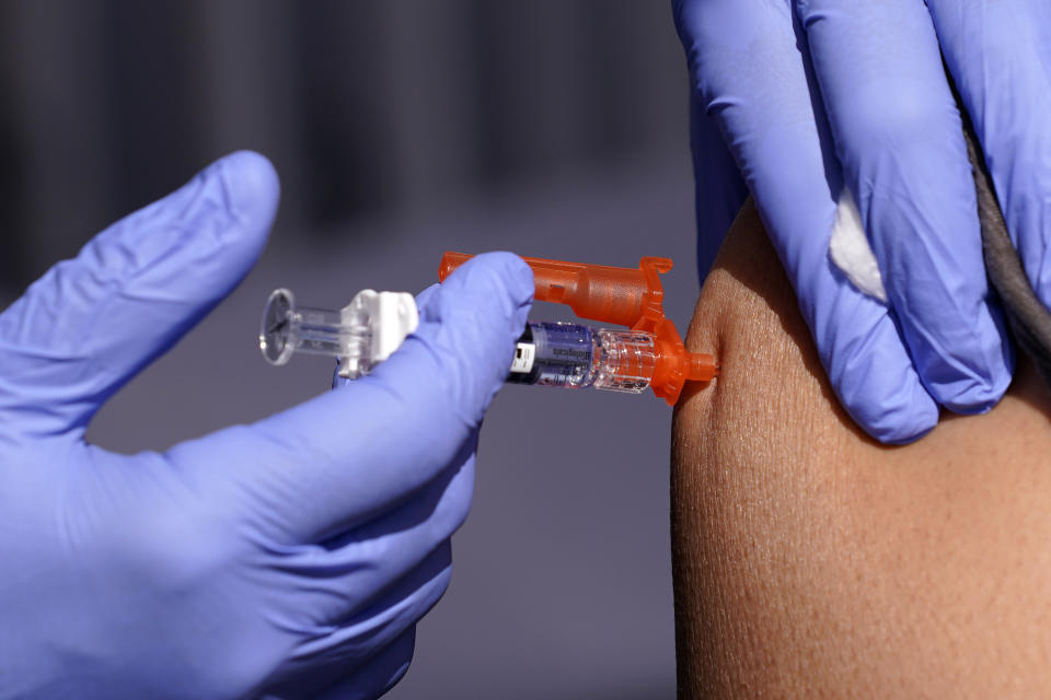 FILE - A patient is given a flu vaccine Friday, Oct. 28, 2022, in Lynwood, Calif. On Friday, Sept. 8, 2023, The Associated Press reported on stories circulating online incorrectly claiming vaccines for the flu, measles, mumps and rubella don’t work because they were developed decades ago, yet the diseases haven’t been eradicated. (AP Photo/Mark J. Terrill, File)