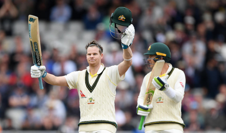 MANCHESTER, ENGLAND - SEPTEMBER 05: Australia batsman Steve Smith celebrates after reaching his century as Tim Paine applauds during day two of the 4th Ashes Test Match between England and Australia at Old Trafford on September 05, 2019 in Manchester, England. (Photo by Stu Forster/Getty Images)