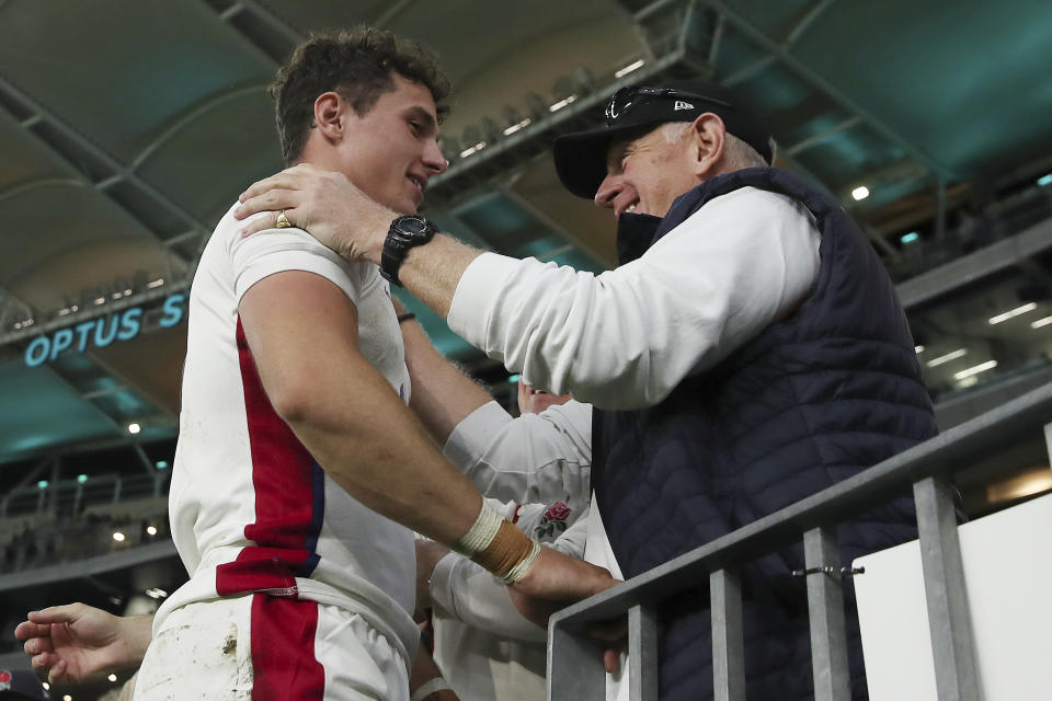 England's Henry Arundell, left, is congratulated by a fan following the rugby international between England and the Wallabies in Perth, Australia, Saturday, July 2, 2022. (AP Photo/Gary Day)