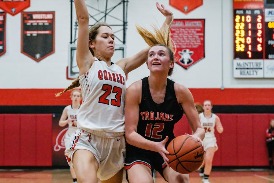 Tusky Valley's Leah Bourquin looks for a shot as New Philadelphia's Carys Young guards, Wednesday, Feb. 8.