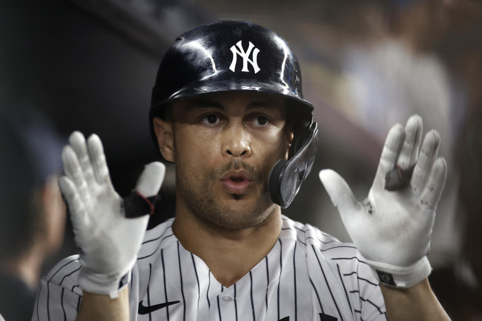 New York Yankees' Giancarlo Stanton celebrates a solo home run during the seventh inning of the team's baseball game against the Philadelphia Phillies on Tuesday, July 20, 2021, in New York. (AP Photo/Adam Hunger)