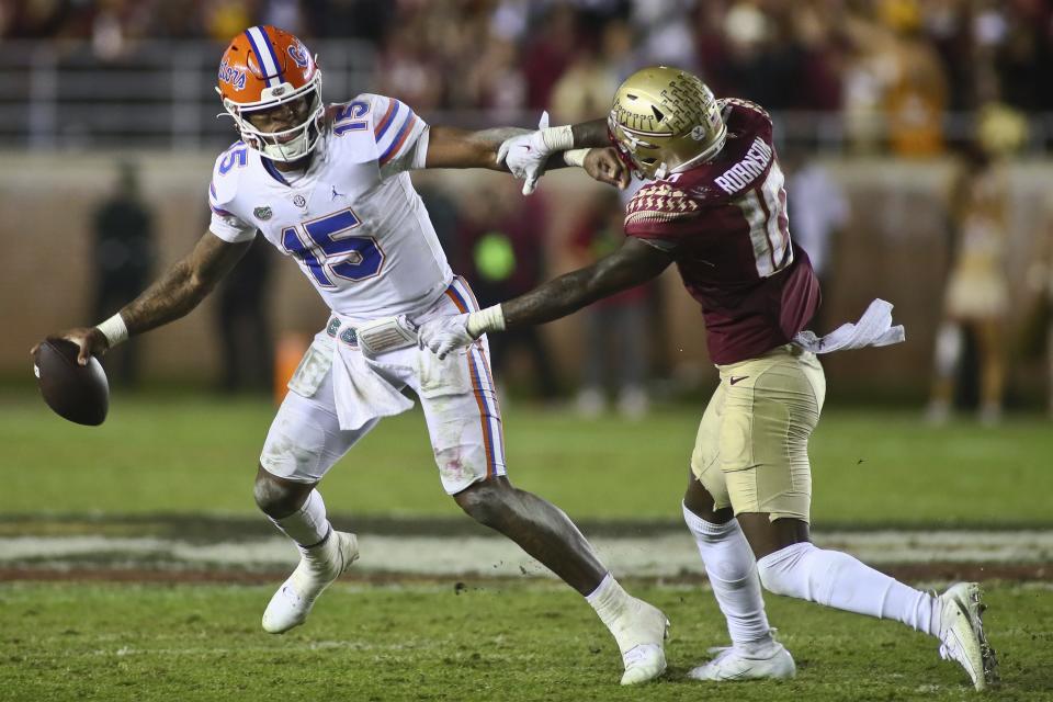 Florida quarterback Anthony Richardson (15), seen here trying to elude Florida State defensive back Jammie Robinson, may be the answer for an AFC South team like the Houston Texans, Indianapolis Colts or Tennessee Titans as their franchise QB, a luxury the Jaguars already have with Trevor Lawrence.