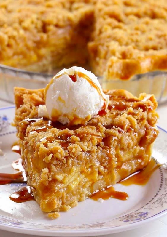 <p>Maria's Kitchen</p><p>Thickly sliced apples, covered in a rich caramel sauce and topped with a crispy golden crumb topping...this is the perfect Dutch caramel apple pie made with a beautiful, buttery and flaky homemade crust.</p><p><strong>Get the recipe: <em><a href="https://www.mariasskitchen.com/buttery-dutch-caramel-apple-pie-recipe/" rel="nofollow noopener" target="_blank" data-ylk="slk:Buttery Dutch Caramel Apple Pie;elm:context_link;itc:0;sec:content-canvas" class="link ">Buttery Dutch Caramel Apple Pie</a></em></strong></p>