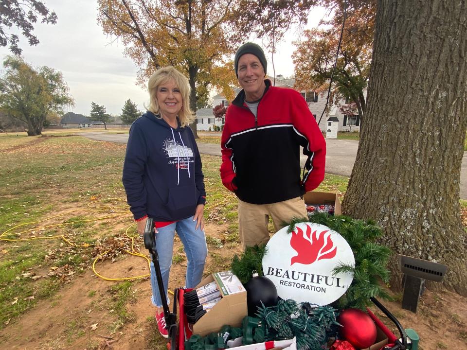 Kaylene Balzer, Beautiful Restoration co-founder  and event designer Ed James stand outside the "mansion on the hill" as they prepare for "Beautiful Lights of Restoration" to be held on the ministry's Edmond property.