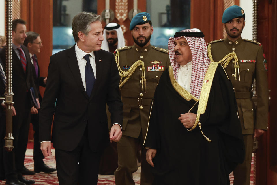 U.S. Secretary of State Antony Blinken, left, walks with Bahrain's King Hamad bin Isa al-Khalifa during his visit in Manama, Bahrain, Wednesday, Jan. 10, 2024. (Evelyn Hockstein/Pool Photo via AP)