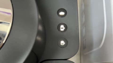 These are the milk function buttons that light up - the manual tells you which ones to press to set up your water hardness