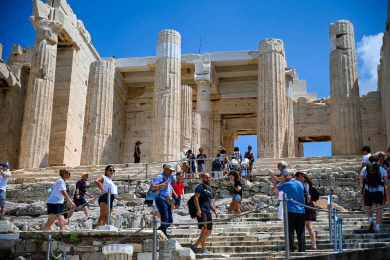 Tourists visit the Acropolis in Athens, Greece where the number of visitors will now be capped at 20,000 a day, through a new booking website, to prevent overcrowding and to preserve the historical landmark. File photo by Thomas Maresca/UPI