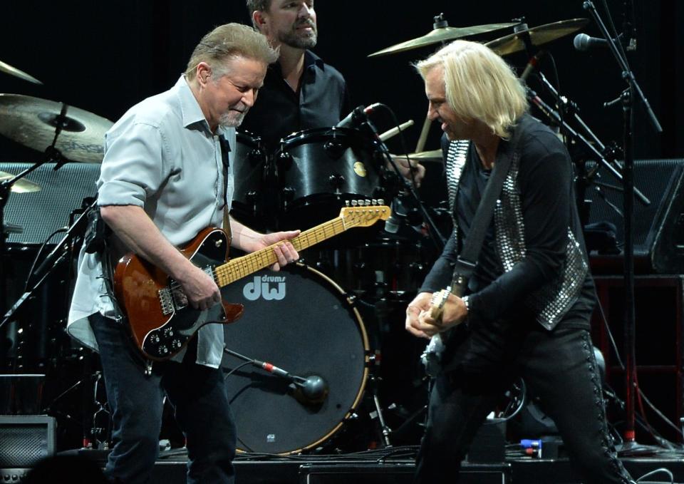 Don Henley (left) and Joe Walsh of the Eagles perform in 2013 during "History Of The Eagles Live In Concert" at the Bridgestone Arena in Nashville.