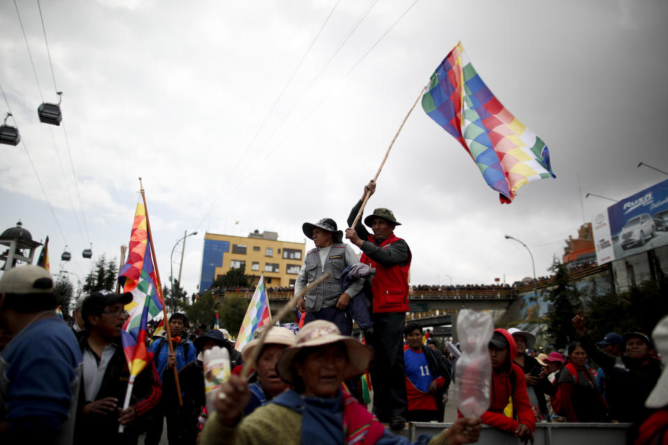 Backers of former President Evo Morales block a highway at El Alto, Bolivia, Thursday, Nov. 14, 2019. (AP Photo/Natacha Pisarenko)