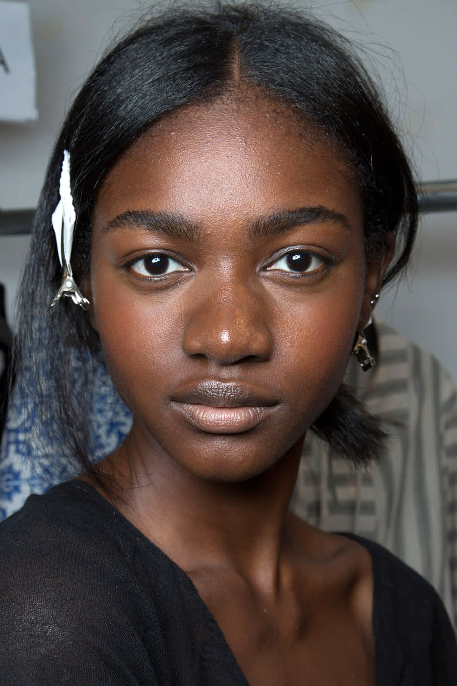 Nars’ key makeup artist James Boehmer created an “undone, no-effort look” that embraced the late-in-the-season humidity. A tiny bit of bronze lipstick was rubbed into the models’ cheeks to play up their post-summer glow, with sheer gloss on lips and lids.