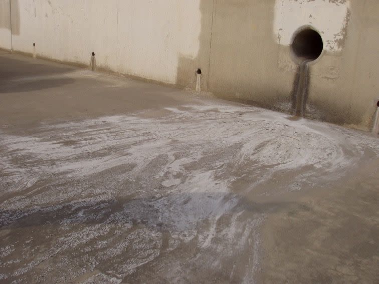 Plastic pellets emptying from a storm drain into the Los Angeles River.