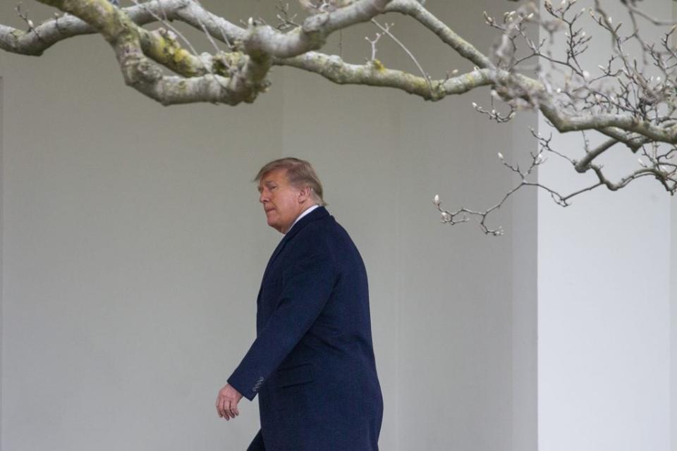 U.S. President Donald Trump walks to the Oval Office while arriving back at the White House on December 31, 2020 in Washington, DC. President Trump and the First Lady returned to Washington, DC early and will not be in attendance at the annual New Years Eve party at his Mar-a-Lago home in Palm Beach. (Photo by Tasos Katopodis/Getty Images)