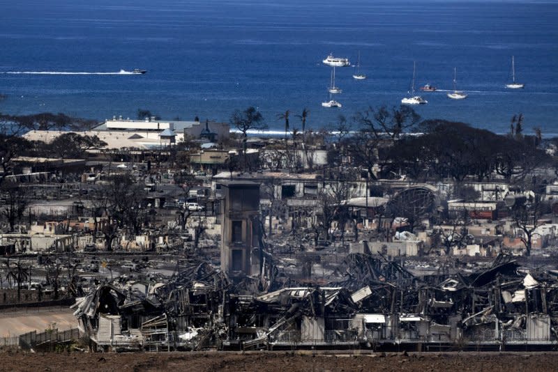 The city of Lahaina lie in ruins in Lahaina, Hawaii, on Friday. At least 93 people were killed in the wildfires burning in Maui, which is considered the largest natural disaster in Hawaii's state history. Photo by Etienne Laurent/EPA-EFE