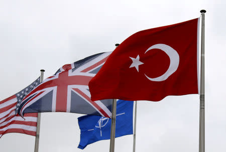 FILE PHOTO: A Turkish flag (R) flies among others flags of NATO members during the North Atlantic Council (NAC) at the Alliance headquarters in Brussels, Belgium, July 28, 2015. REUTERS/Francois Lenoir/File Photo