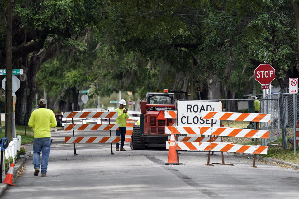 A city street is seen closed for repairs and upgrades,Thursday, April 1, 2021, in Orlando, Fla. As part of an infrastructure proposal by the Biden administration, $115 billion is earmarked to modernize the bridges, highways and roads that are in the worst shape. (AP Photo/John Raoux)