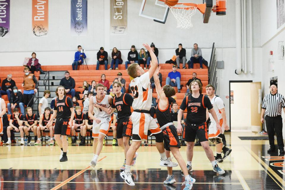 Rudyard's Austin Warner (23) puts up a shot during a basketball game against Munising Saturday. The Bulldogs beat the Mustangs in a matchup between unbeaten teams.