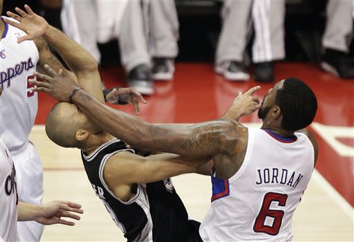 San Antonio Spurs' Tony Parker, left, of France, is fouled by Los Angeles Clippers' DeAndre Jordan during the first half in Game 4 of an NBA basketball playoffs Western Conference semifinal game in Los Angeles, Sunday, May 20, 2012. (AP Photo/Jae C. Hong)