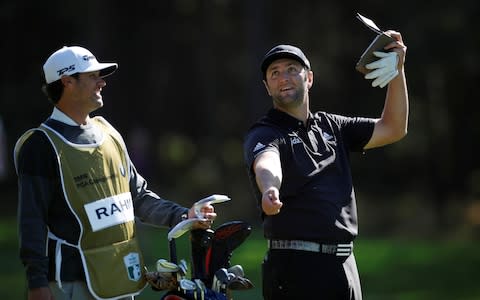 Spain's Jon Rahm with his caddie during the second round  - Credit: Action Images via Reuters/Paul Childs