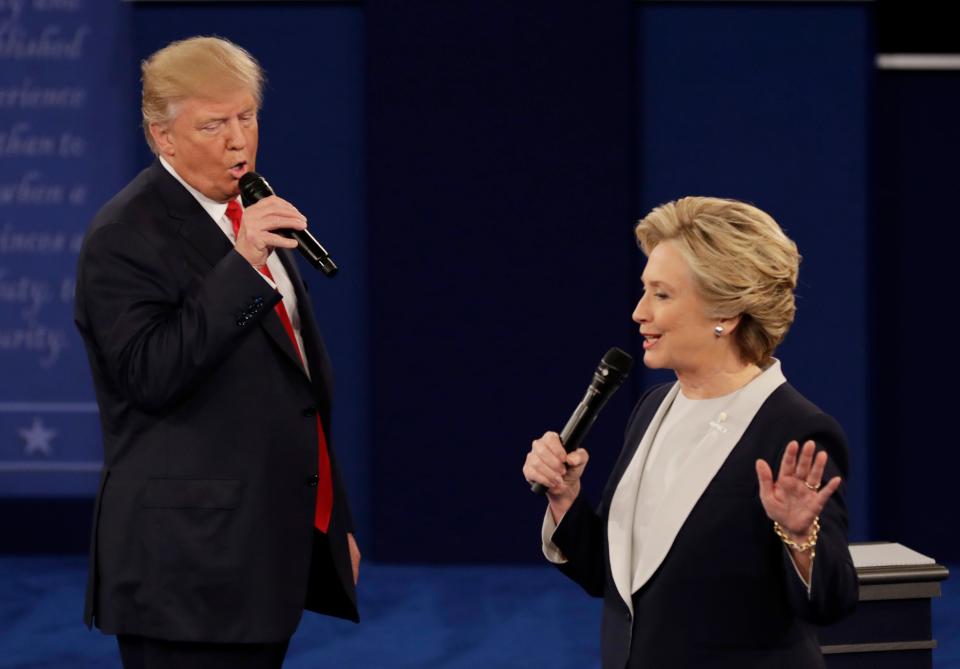 In this Oct. 9, 2016, file photo Republican presidential nominee Donald Trump and Democratic presidential nominee Hillary Clinton speak during the second presidential debate at Washington University in St. Louis.