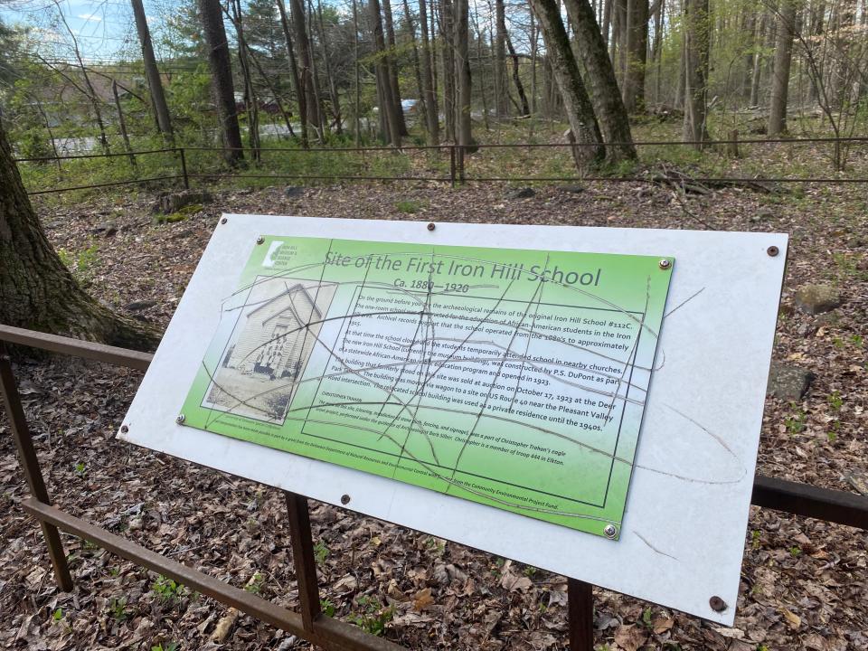 Signs damaged on trials operated by the Delaware Academy of Science, include this one explaining where the original Iron Hill School was located. The school was constructed to education Black students in Iron Hill area before schools were desegregated.