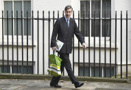 Leader of the House of Commons Jacob Rees-Mogg arrives for a Cabinet meeting at 10 Downing Street in London, Tuesday Oct. 8, 2019. Britain and the European Union appeared to be poles apart Monday on a potential Brexit deal. (Stefan Rousseau/PA via AP)