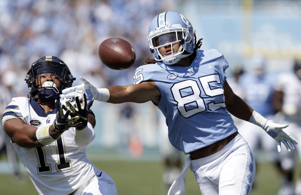 FILE - In a Saturday, Sept. 22, 2018 file photo, Pittsburgh's Dane Jackson (11) and North Carolina's Roscoe Johnson (85) reach for a pass during the first half of an NCAA college football game in Chapel Hill, N.C. Pittsburgh and Eastern Michigan will meet in the Quick Lane Bowl, on Dec. 26, 2019, hoping to end postseason droughts. (AP Photo/Gerry Broome, File)