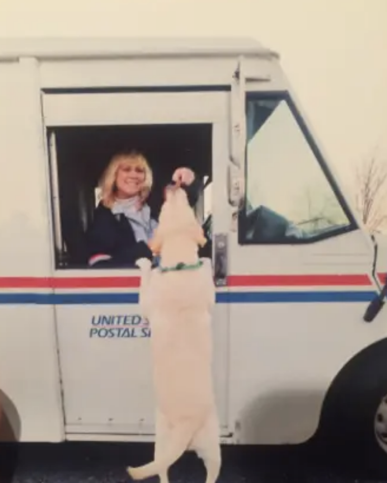 The author's mother greeting a dog