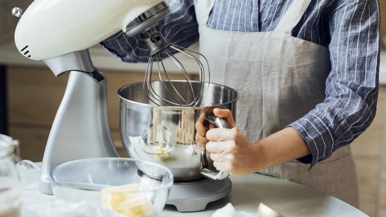 Woman using stand mixer