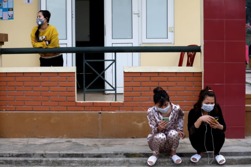 FILE PHOTO: Vietnamese people, who come back from China, are seen inside a quarantine area at a military base in Lang Son province, Vietnam