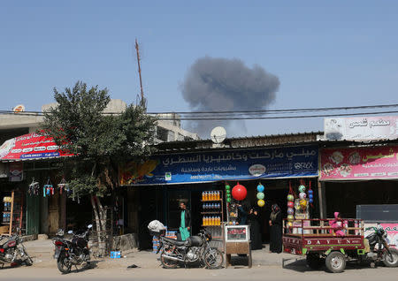 Smoke rises following what police said was an Israeli air strike in Rafah in the southern Gaza Strip February 27, 2017. REUTERS/Ibraheem Abu Mustafa