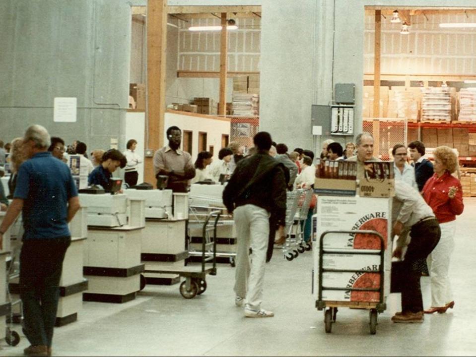 costco opening register line with customers Jim in background