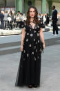 The British actress, who just announced her second pregnancy, covered up her baby bump in a loose floral dress for the fashion label's show on May 2, 2019. <em>[Photo: Getty]</em>