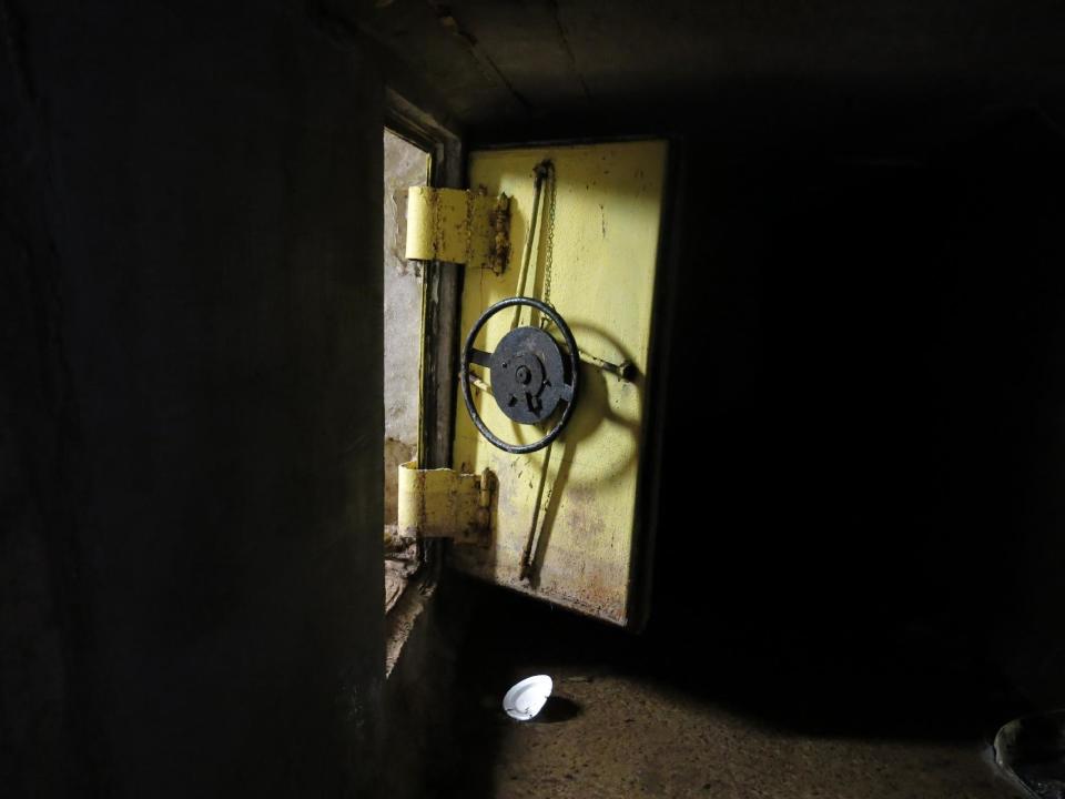 An open steel reinforced door leads to a series of interconnected tunnels in the city's drainage system in the city of Culiacan, Mexico, Sunday Feb. 23, 2014. A day after troops narrowly missed infamous drug boss Joaquin Guzman Loera, "El Chapo" in Culiacan, one of his top aides was arrested. Officials said he told investigators that he picked up Guzman from a drainage pipe and helped him flee to Mazatlan but a wiretap being monitored by ICE agents in southern Arizona provided the final clue that led to the arrest of one of the worlds most wanted men. (AP Photo/Adriana Gomez)