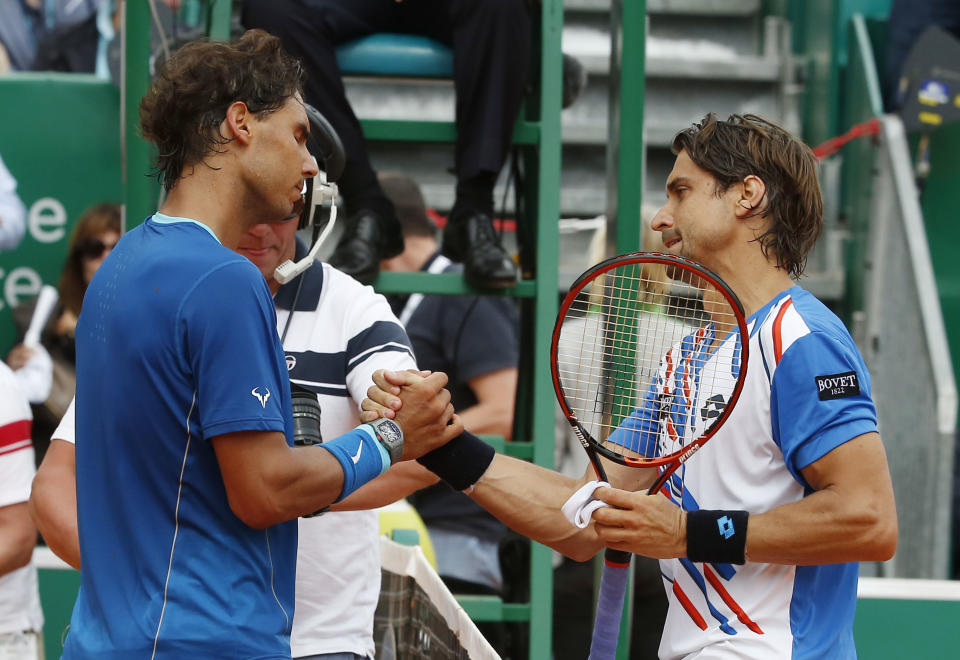 Rafael Nadal of Spain, left, and David Ferrer of Spain, right, shake hands after their quarterfinals match of the Monte Carlo Tennis Masters tournament in Monaco, Friday, April 18, 2014. Ferrer won 7-6 6-4. (AP Photo/Michel Euler)