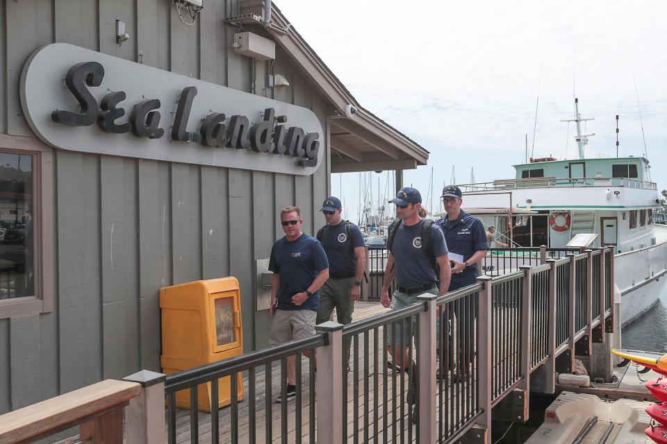 A crew with the U.S. Coast Guard leaves Sea Landing after investigating the sister boats to the Conception in the Santa Barbara Harbor, September 2, 2019.