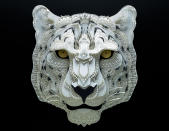 <p>Intricate paper cut out of a snow leopard. (Photo: Patrick Cabral/Caters News </p>