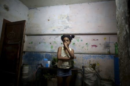 Marcia Sanchez, 7, niece of Yolanda Sanchez, (not pictured), stands in her home in Havana, March 19, 2016. REUTERS/Alexandre Meneghini