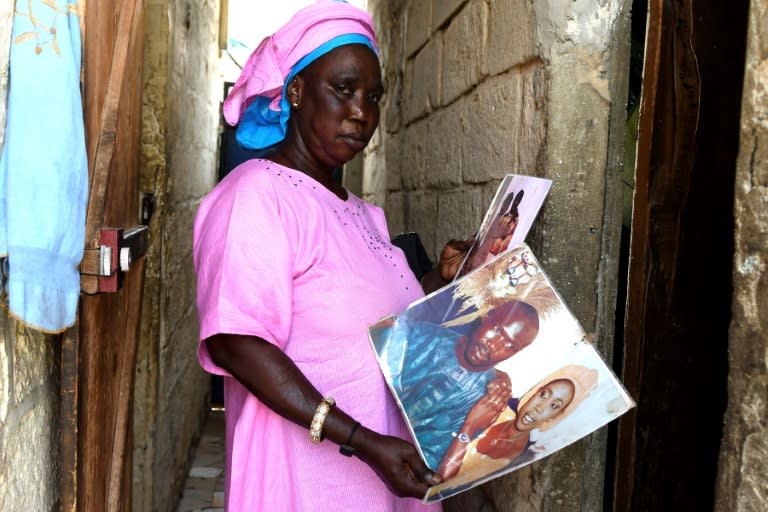 Khady Dieye holds photographs of her husband who left the family home on Senegal's northern coast and boarded a dugout canoe in the hope of reaching Spain. Like many other would-be migrants, he disappeared, leaving his family not knowing whether he was dead or alive, stuck between hope and grief "Since then, we have not had any news of him," said Dieye, who lives in the small fishing village of Ndiebene-Gandiol near Saint-Louis